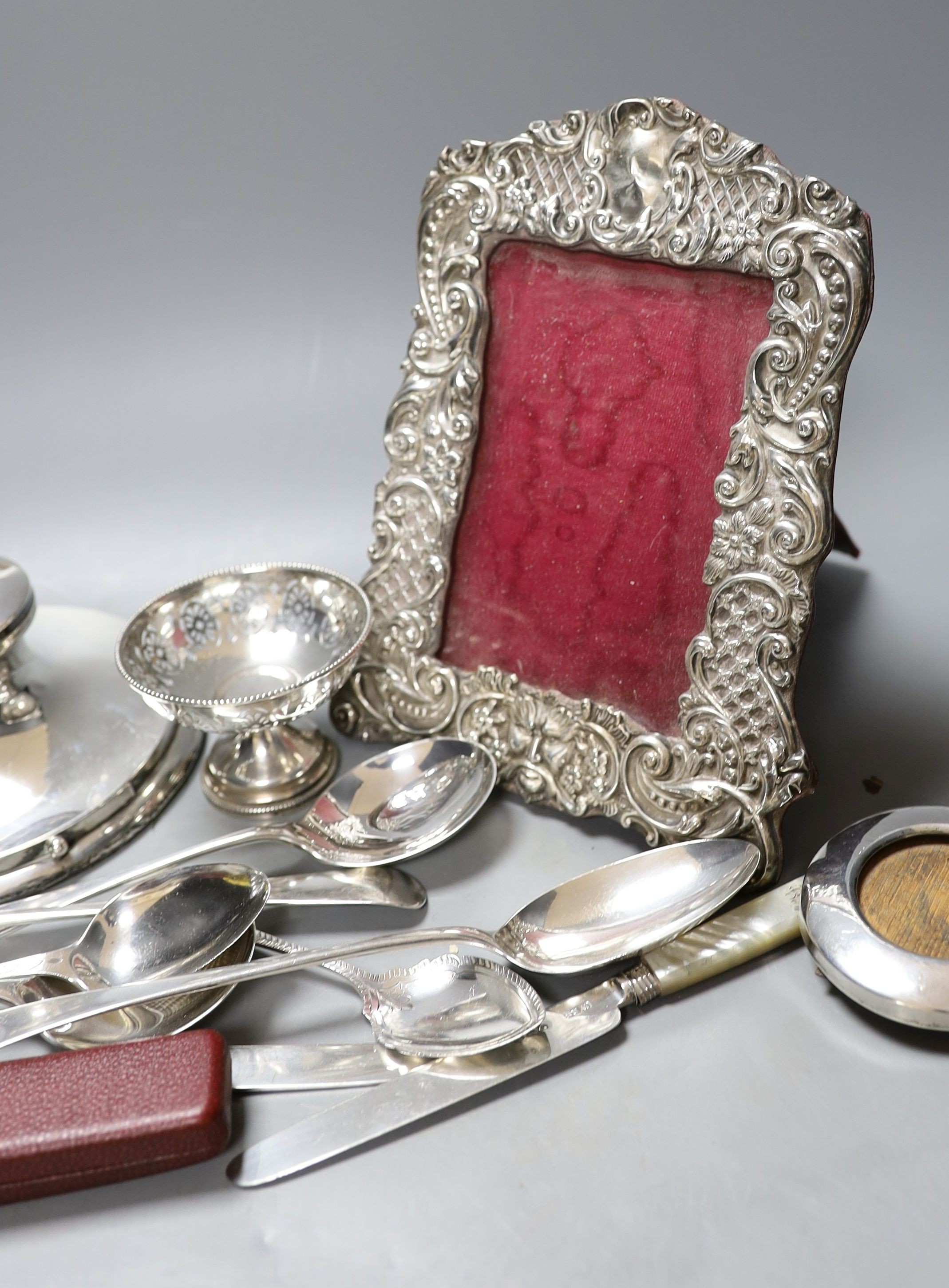 Assorted small silver including a photograph frame, flatware, inkwell and small pedestal dish, etc.